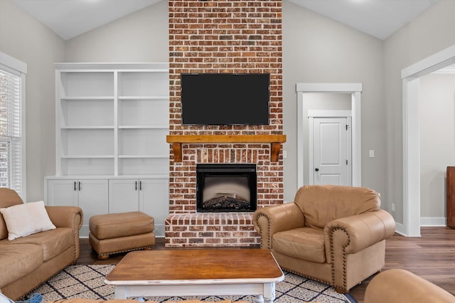 7181 Moontown Rd, Appling, GA 30802 - living room featuring lofted ceiling, light wood-type flooring, and a fireplace