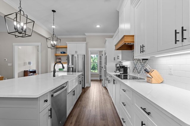 7181 Moontown Rd, Appling, GA 30802 - kitchen with stainless steel appliances, a chandelier, light countertops, dark wood-type flooring, and a kitchen island with sink