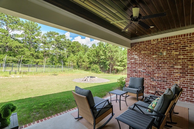 7181 Moontown Rd, Appling, GA 30802 - view of patio / terrace with ceiling fan, view of scattered trees, and an outdoor living space with a fire pit