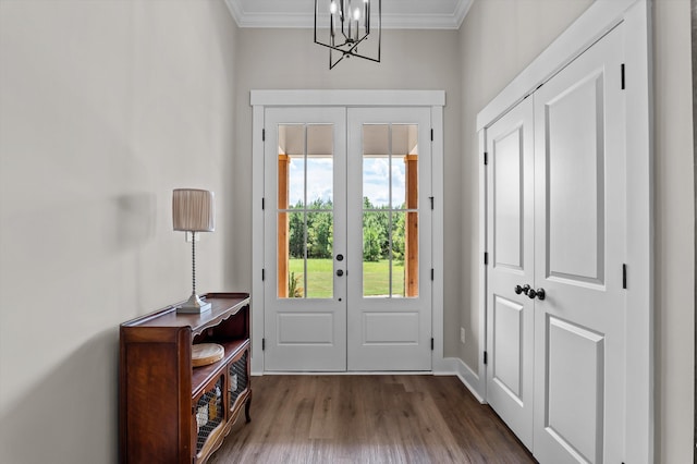 7181 Moontown Rd, Appling, GA 30802 - foyer entrance with french doors, dark wood-style flooring, crown molding, and a chandelier