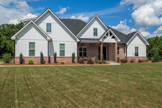 7181 Moontown Rd, Appling, GA 30802 - view of front of house featuring brick siding, a front lawn, and board and batten siding