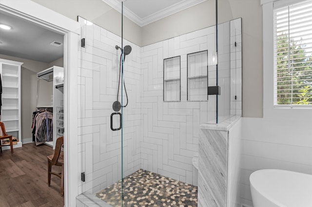 7181 Moontown Rd, Appling, GA 30802 - bathroom featuring a stall shower, a freestanding tub, a spacious closet, crown molding, and healthy amount of natural light