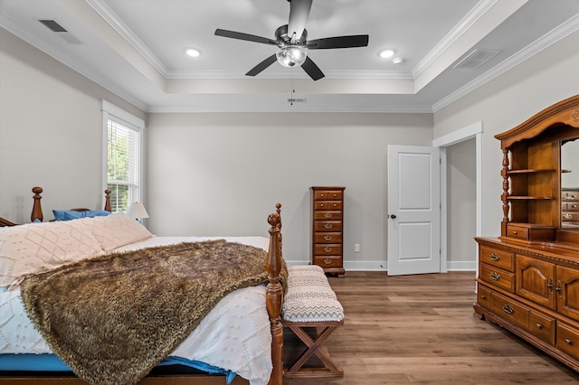 7181 Moontown Rd, Appling, GA 30802 - bedroom with a raised ceiling, dark wood-style floors, ornamental molding, a ceiling fan, and recessed lighting