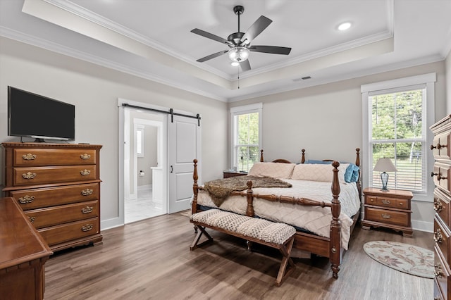 7181 Moontown Rd, Appling, GA 30802 - bedroom featuring a barn door, multiple windows, wood finished floors, crown molding, and recessed lighting