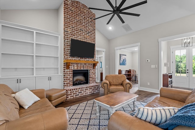 7181 Moontown Rd, Appling, GA 30802 - living room featuring wood finished floors, a brick fireplace, ceiling fan, a chandelier, and recessed lighting