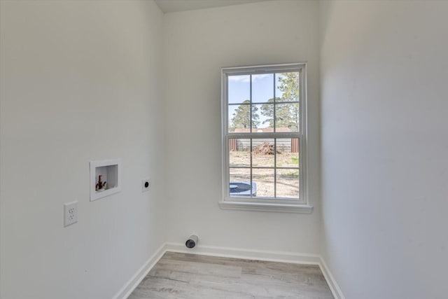 laundry room with hookup for a washing machine, light wood-style floors, electric dryer hookup, laundry area, and baseboards