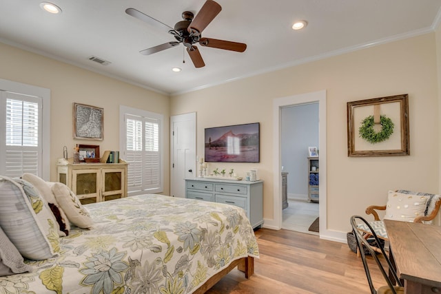 bedroom with visible vents, ornamental molding, baseboards, recessed lighting, and light wood-style flooring
