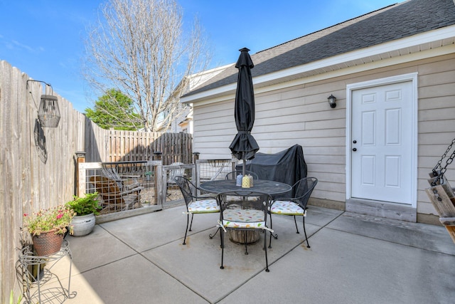 view of patio / terrace featuring fence and outdoor dining space
