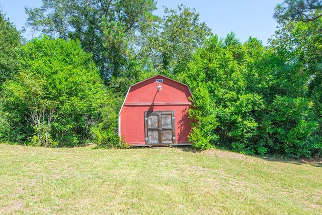 view of outdoor structure with a lawn