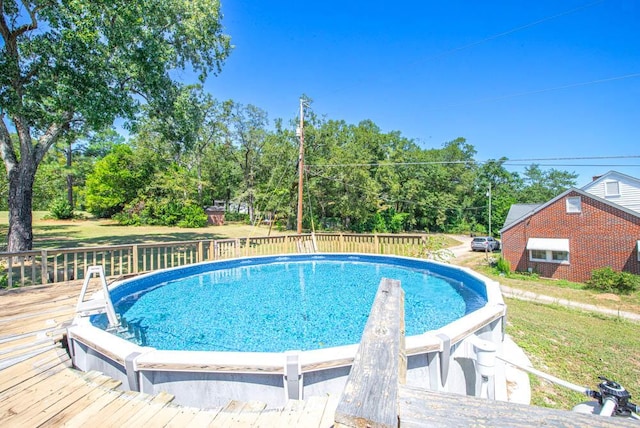 view of pool featuring a wooden deck