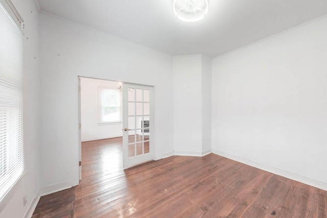 spare room with hardwood / wood-style flooring