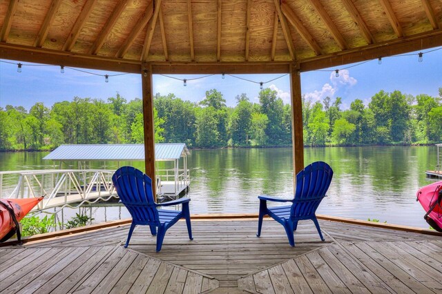 dock area with a gazebo and a water view