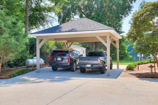 view of vehicle parking with a carport