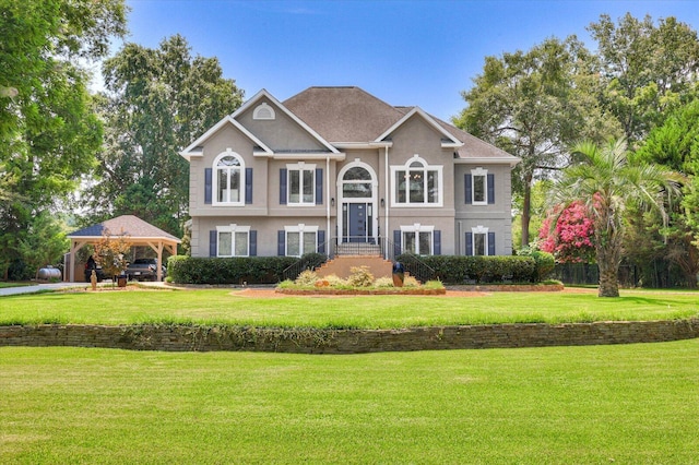 raised ranch with a gazebo and a front yard