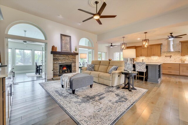 living room with a fireplace and light hardwood / wood-style floors