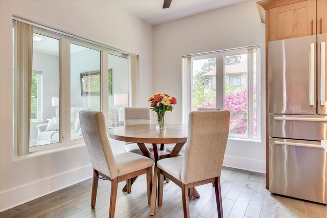 dining area featuring light wood-type flooring