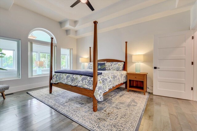 bedroom with ceiling fan and wood-type flooring