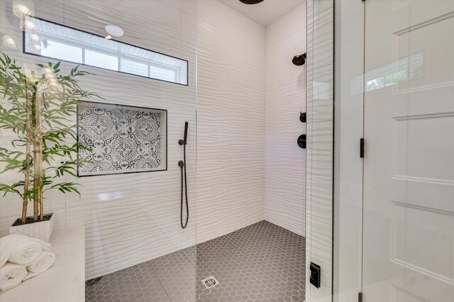 bathroom with tiled shower