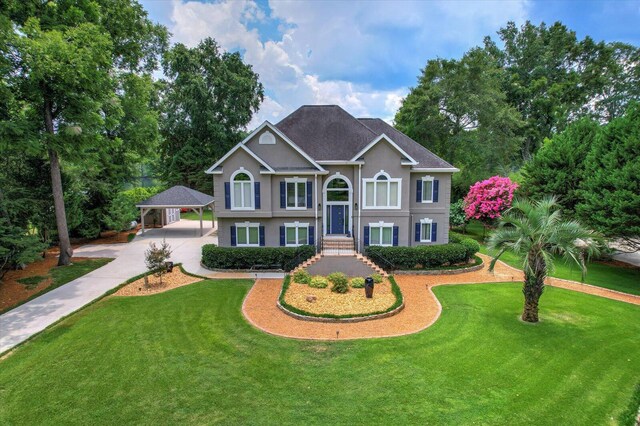 split foyer home with a carport and a front yard