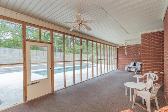 2114 Southlake Pkwy, Augusta, GA 30906 - sunroom / solarium featuring a ceiling fan, carpet flooring, and brick wall