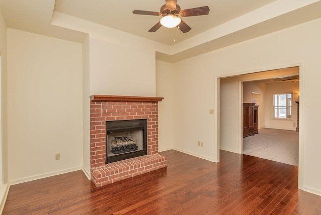 2114 Southlake Pkwy, Augusta, GA 30906 - unfurnished living room featuring wood finished floors, a brick fireplace, and ceiling fan