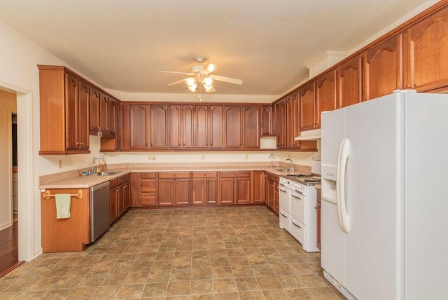 2114 Southlake Pkwy, Augusta, GA 30906 - kitchen with white refrigerator with ice dispenser, stainless steel dishwasher, ceiling fan, light countertops, and brown cabinets