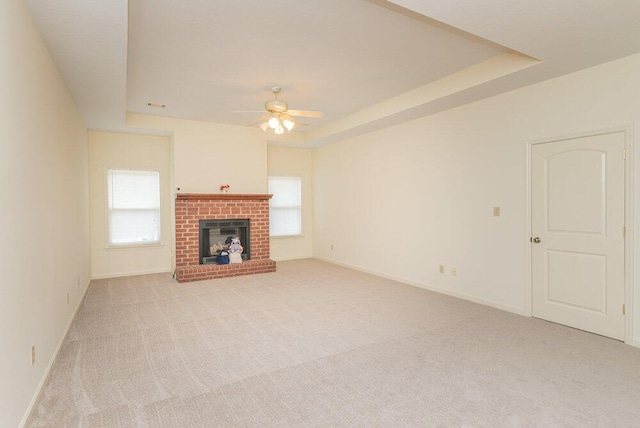 2114 Southlake Pkwy, Augusta, GA 30906 - unfurnished living room with light carpet, plenty of natural light, ceiling fan, and a fireplace