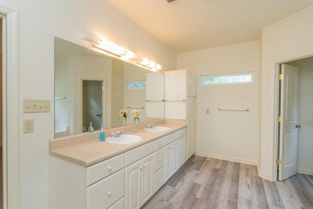 2114 Southlake Pkwy, Augusta, GA 30906 - full bathroom featuring double vanity and wood finished floors