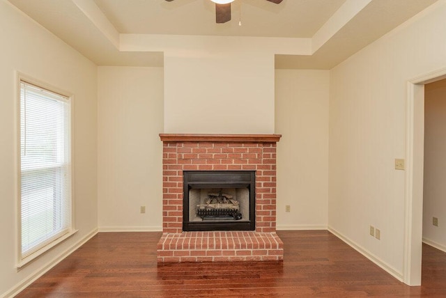 2114 Southlake Pkwy, Augusta, GA 30906 - unfurnished living room featuring plenty of natural light, wood finished floors, a fireplace, and a ceiling fan