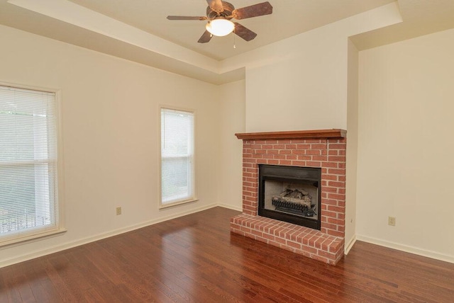 2114 Southlake Pkwy, Augusta, GA 30906 - unfurnished living room with wood finished floors, a brick fireplace, and ceiling fan