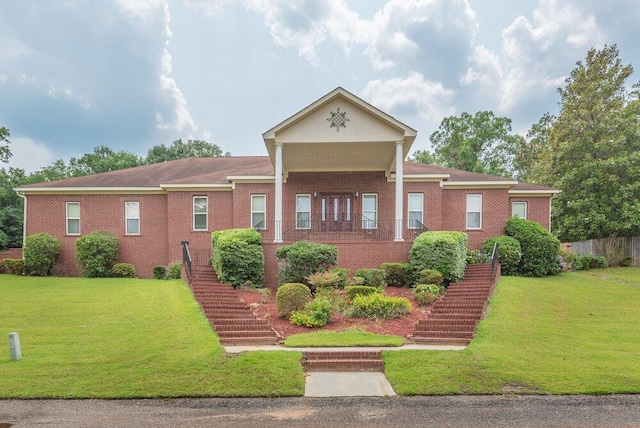 2114 Southlake Pkwy, Augusta, GA 30906 - neoclassical / greek revival house with stairway, a front yard, and brick siding