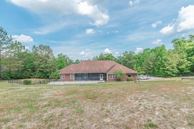 2114 Southlake Pkwy, Augusta, GA 30906 - rear view of house with a fenced backyard and a sunroom