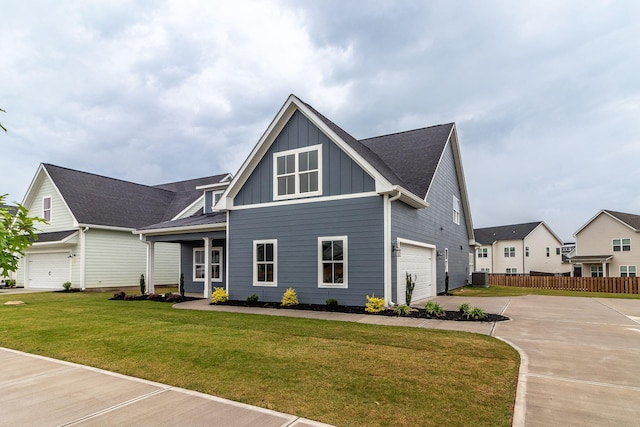 view of front of property with central air condition unit, a front yard, and a garage