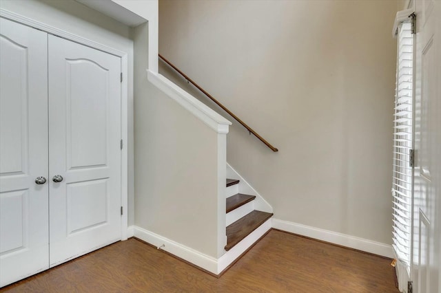 stairway with hardwood / wood-style flooring