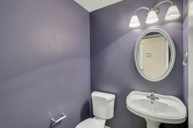 bathroom with sink and toilet