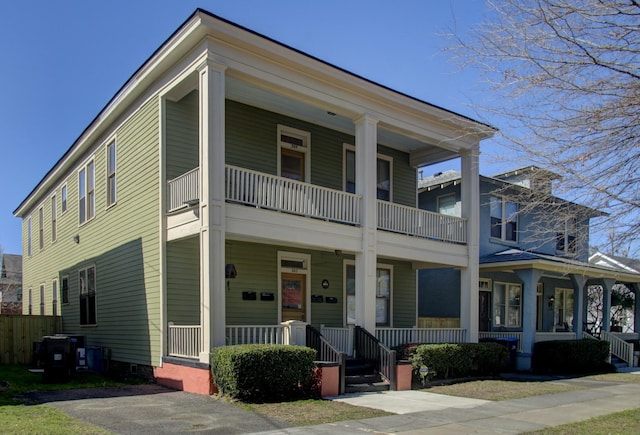 neoclassical / greek revival house featuring a porch