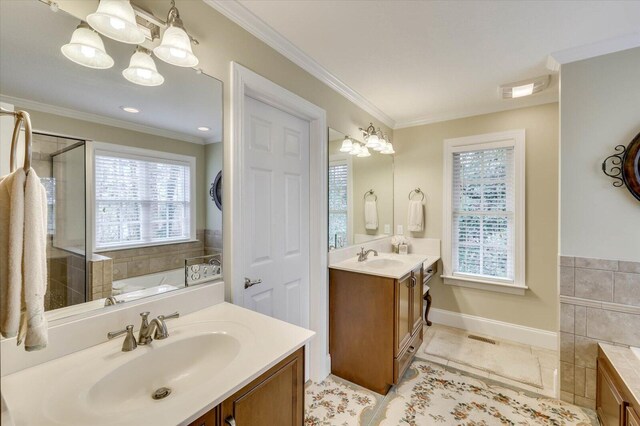 bathroom with a notable chandelier, vanity, ornamental molding, and a tub to relax in