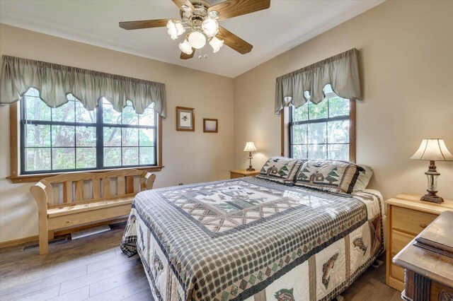 bedroom featuring ceiling fan and hardwood / wood-style flooring