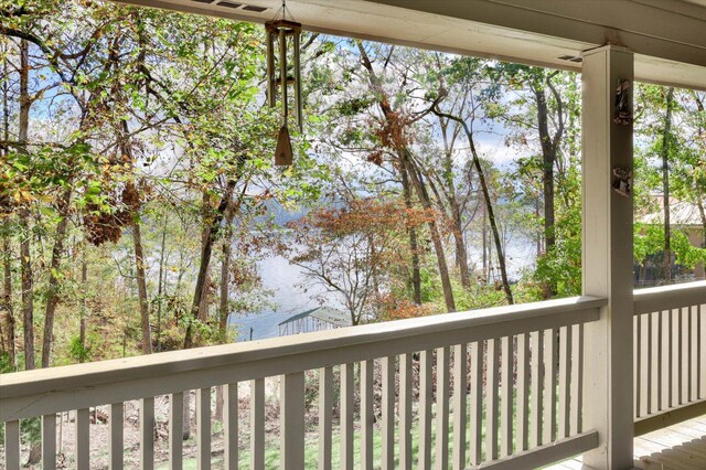 wooden deck with a water view