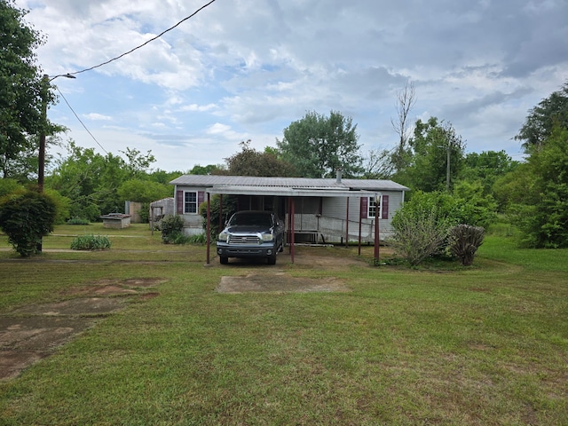 1667 Eden Hall Rd, Bradley, SC 29819 - view of front of home featuring a front lawn, a carport, metal roof, and driveway