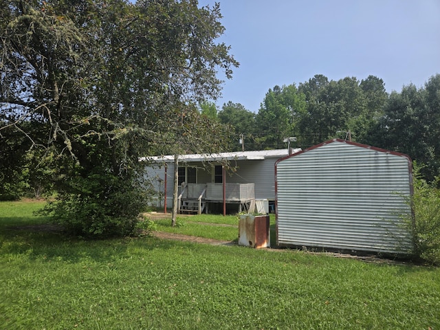 1667 Eden Hall Rd, Bradley, SC 29819 - rear view of house featuring a yard and metal roof