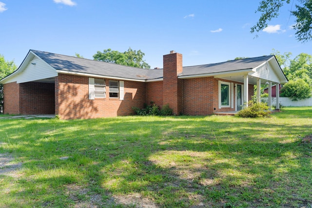 108 Frances Dr, North Augusta, SC 29841 - back of property featuring brick siding, a chimney, and a lawn