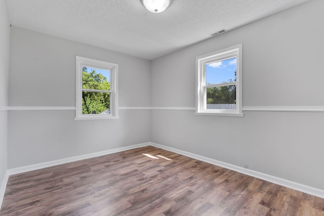108 Frances Dr, North Augusta, SC 29841 - empty room with plenty of natural light, a textured ceiling, and wood finished floors