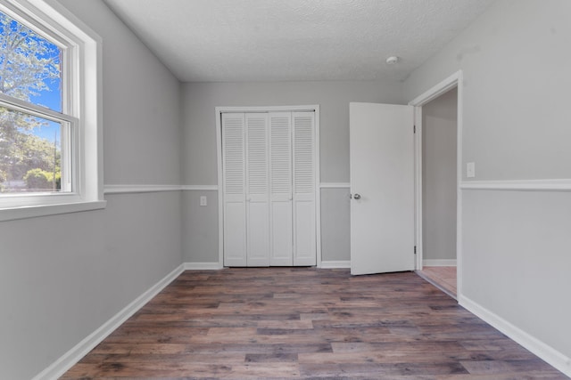 108 Frances Dr, North Augusta, SC 29841 - unfurnished bedroom featuring a textured ceiling, wood finished floors, and a closet