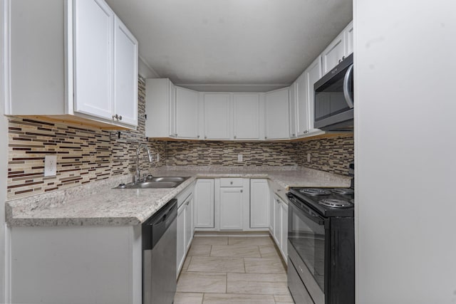 108 Frances Dr, North Augusta, SC 29841 - kitchen with appliances with stainless steel finishes, white cabinets, light countertops, decorative backsplash, and light marble finish flooring
