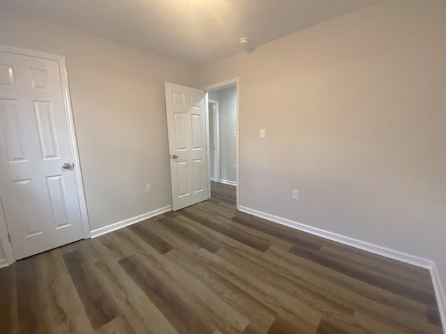 2113 Dyer St, Augusta, GA 30901 - unfurnished bedroom with dark wood-type flooring and baseboards