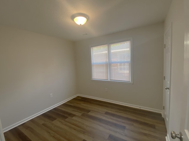 2113 Dyer St, Augusta, GA 30901 - empty room featuring dark wood-style flooring and baseboards