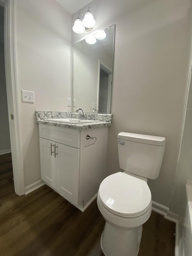 2113 Dyer St, Augusta, GA 30901 - bathroom featuring vanity, wood finished floors, toilet, and baseboards