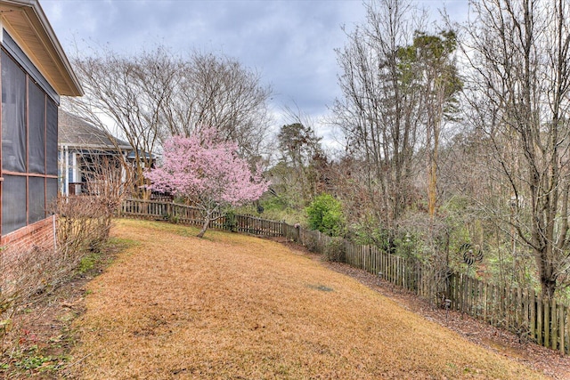 view of yard with a fenced backyard