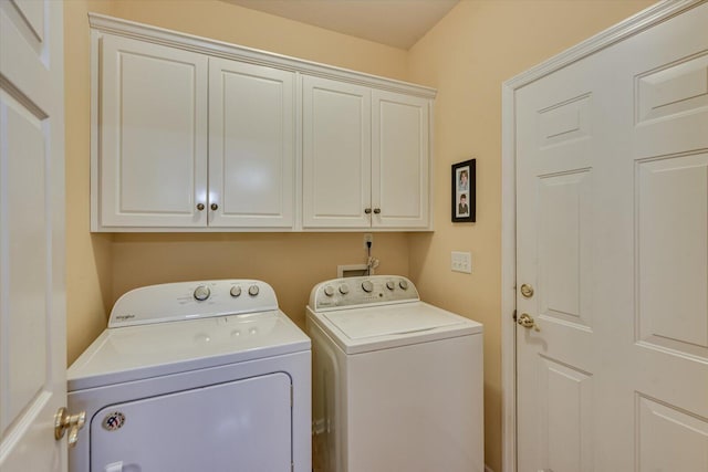 laundry room with cabinet space and washer and dryer